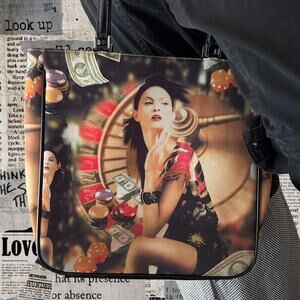 Statement graphic shoulder bag with bold casino inspired print